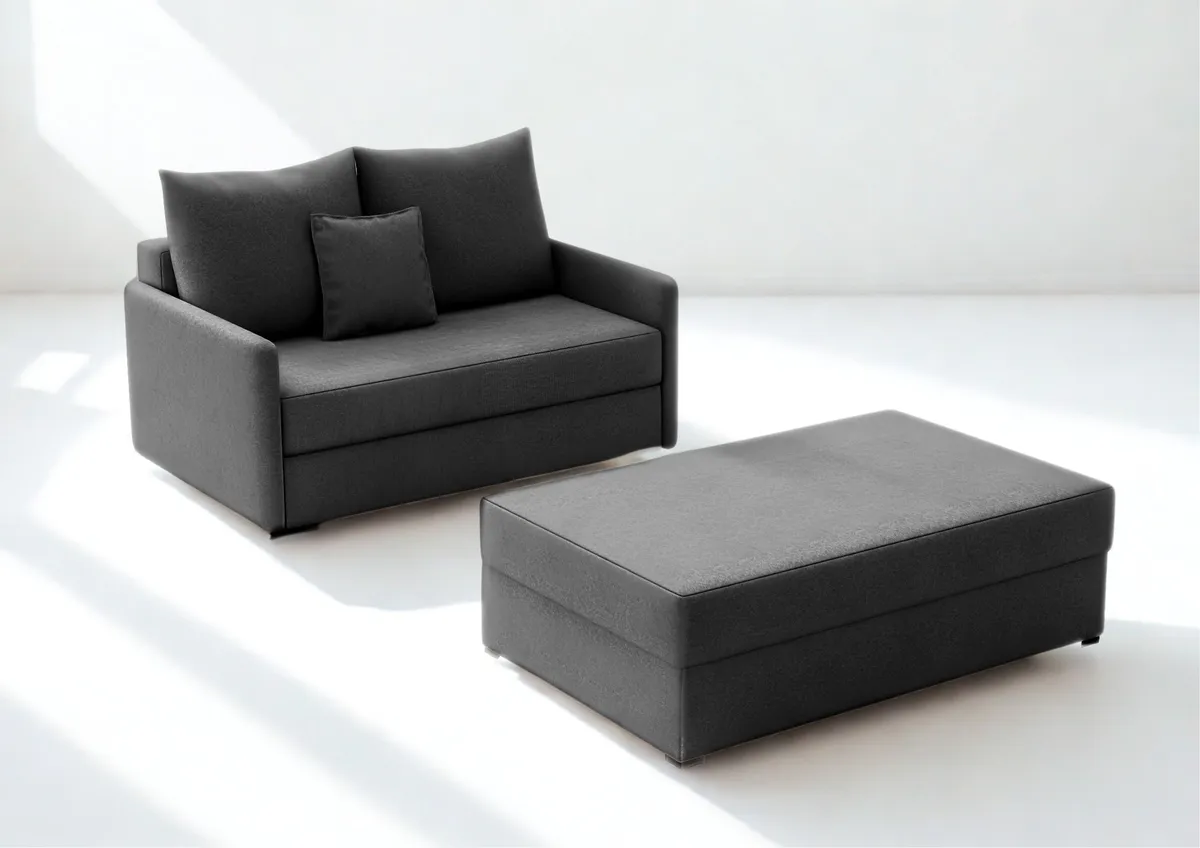 Sofa grafitowa ARKADIA z funkcją spania z pufą 130 cm: Grafitowa sofa ARKADIA