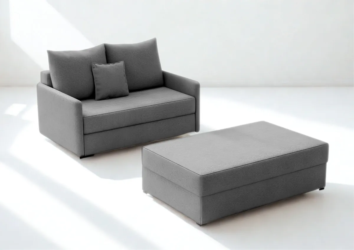 Sofa szara ARKADIA z funkcją spania z pufą 130 cm: Szara sofa ARKADIA